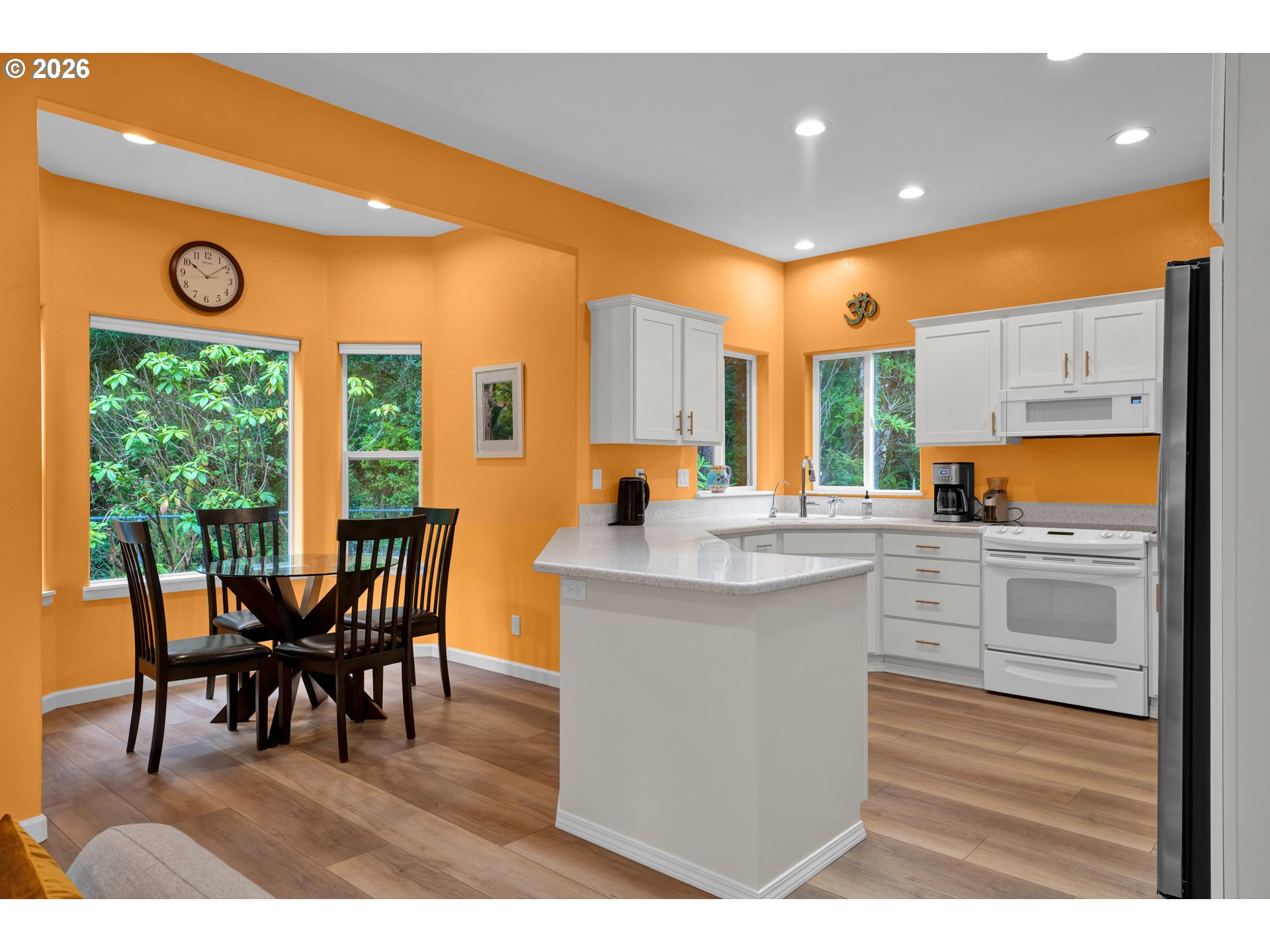 88017 South Wind Jammer Street Florence, OR 97439 - Photo 18 of 48 a kitchen with a table chairs and sink