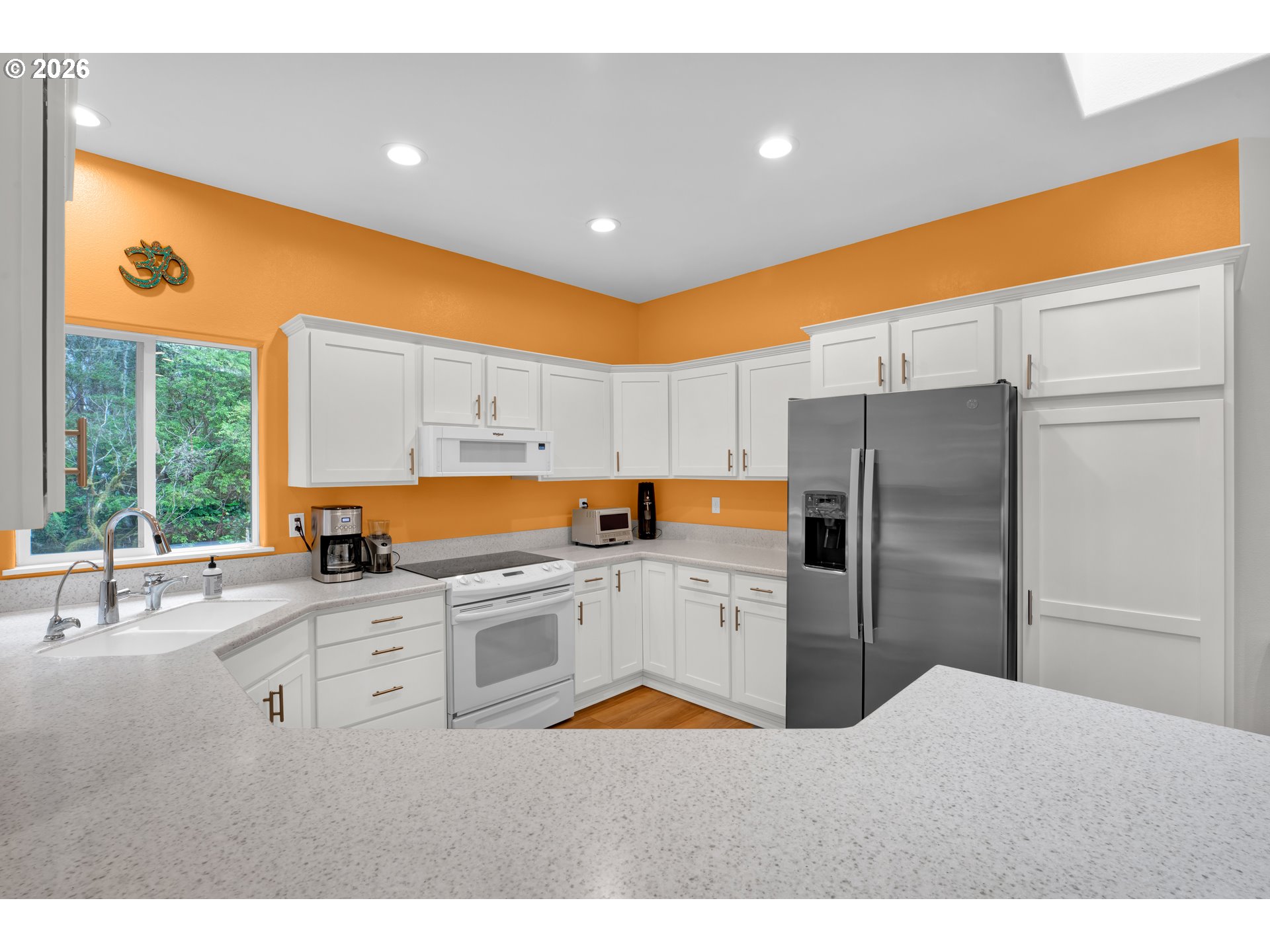 88017 South Wind Jammer Street Florence, OR 97439 - Photo 20 of 48 a kitchen with stainless steel appliances kitchen island granite countertop a refrigerator and a sink
