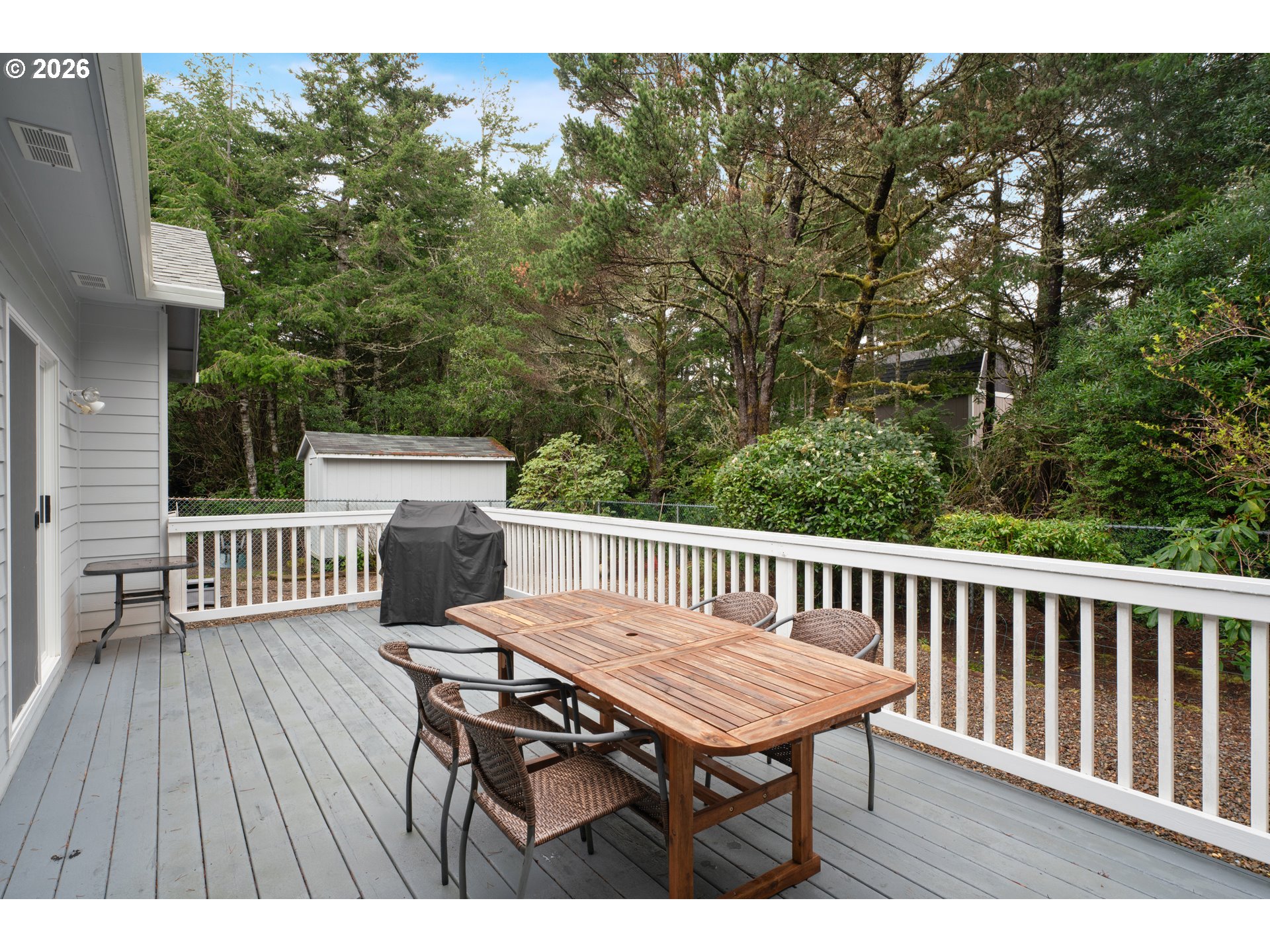88017 South Wind Jammer Street Florence, OR 97439 - Photo 23 of 48 a view of a table and chairs on the roof deck
