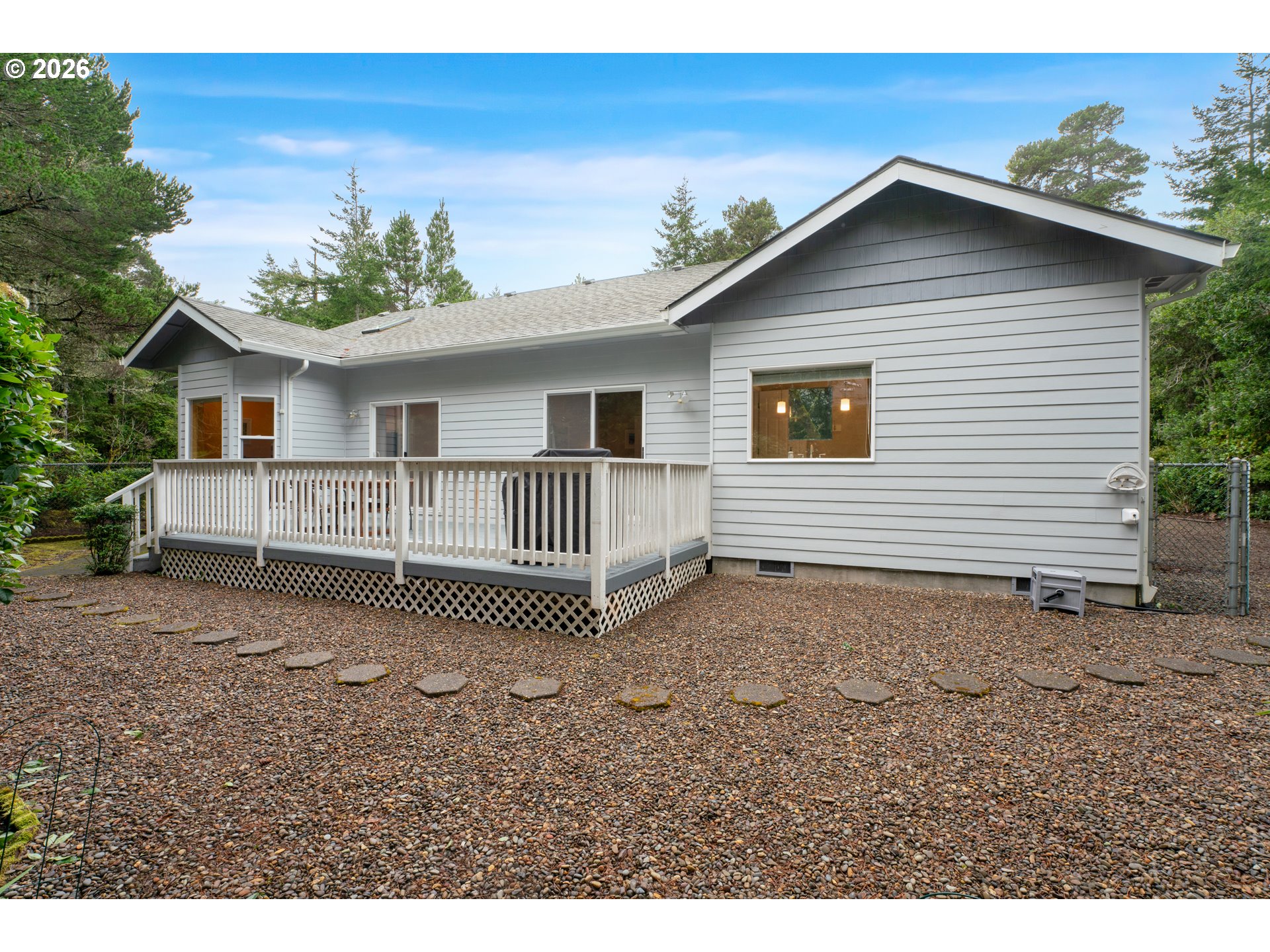 88017 South Wind Jammer Street Florence, OR 97439 - Photo 42 of 48 a view of a house with a yard and potted plants
