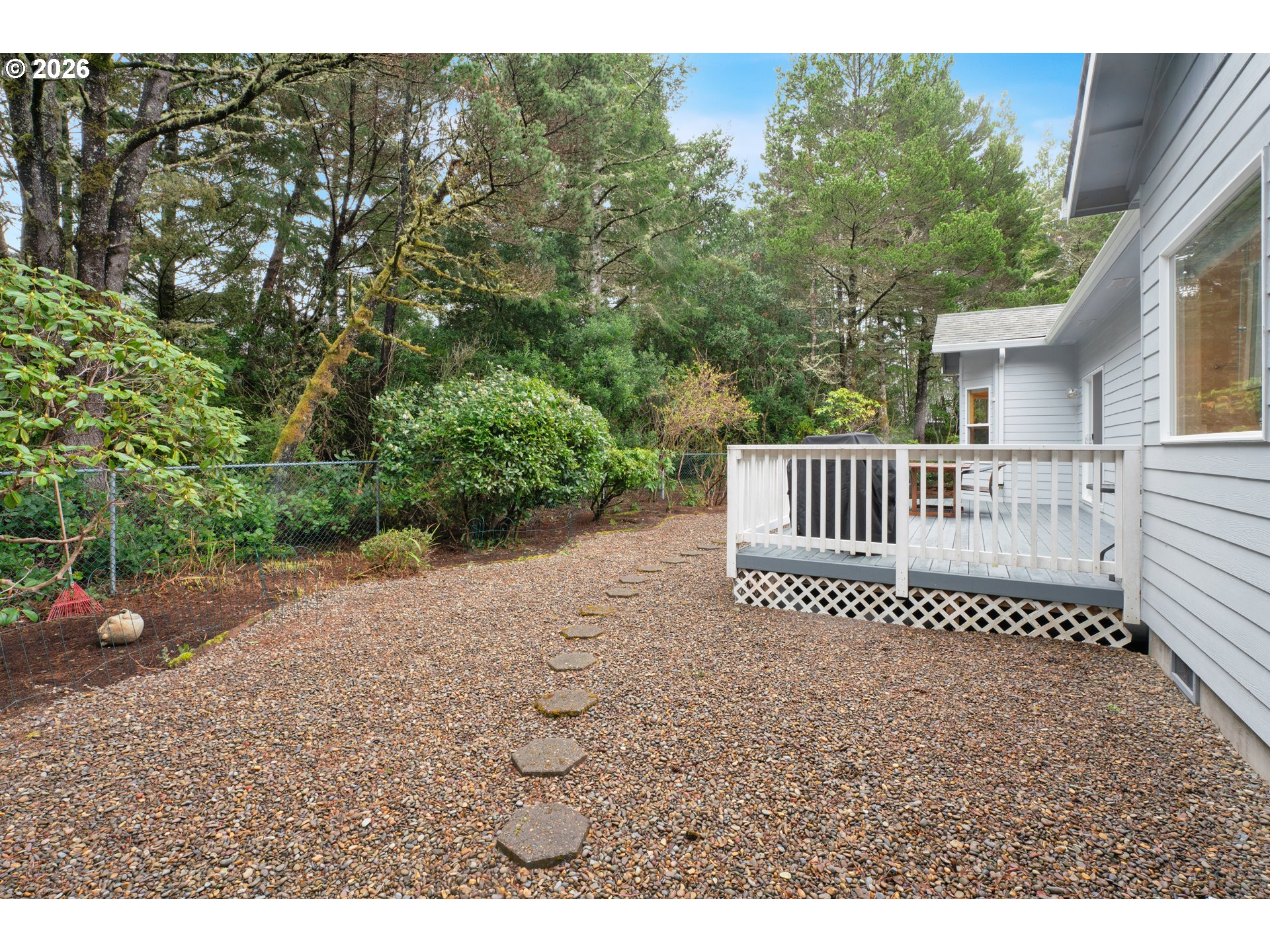 88017 South Wind Jammer Street Florence, OR 97439 - Photo 43 of 48 a view of a hardwood floor and bench in the backyard