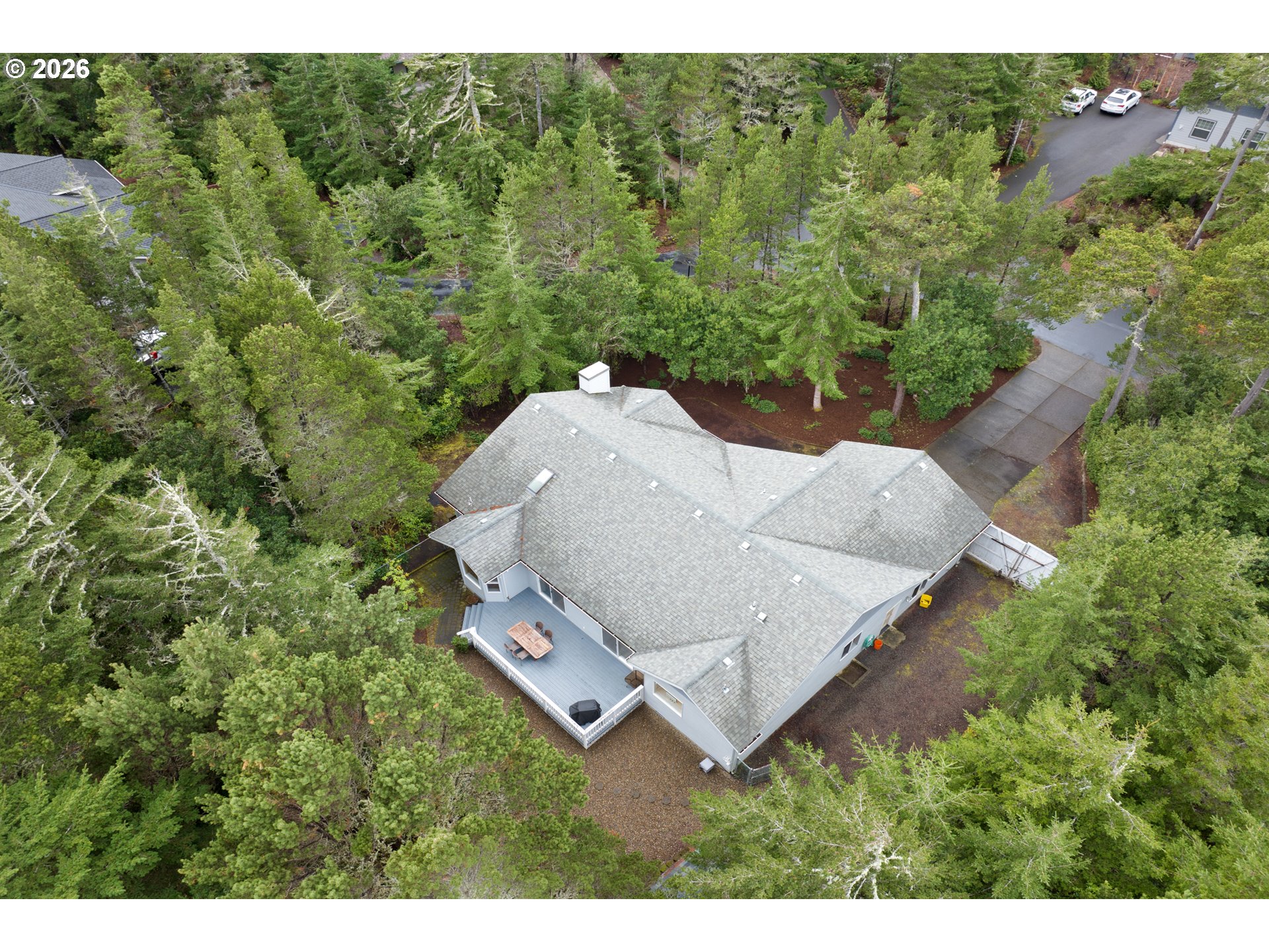 88017 South Wind Jammer Street Florence, OR 97439 - Photo 45 of 48 a aerial view of a house with yard and outdoor seating