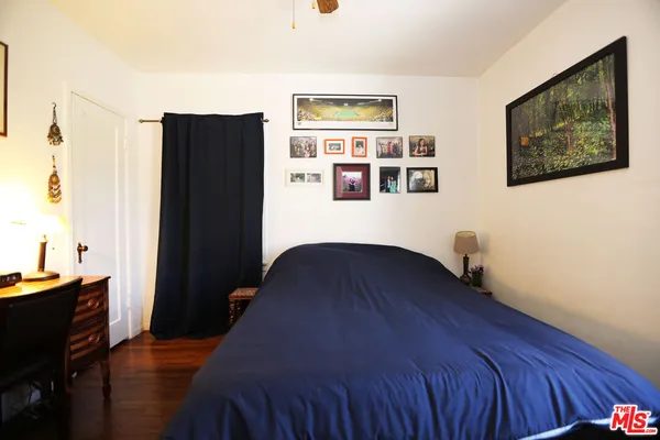 a bedroom with a bed and furniture