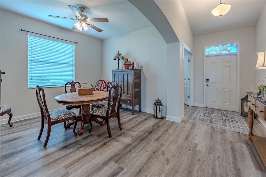9224 Southwest 60th Ct Road Ocala, FL 34476 - Photo 23 of 55 a view of a dining room with furniture and wooden floor