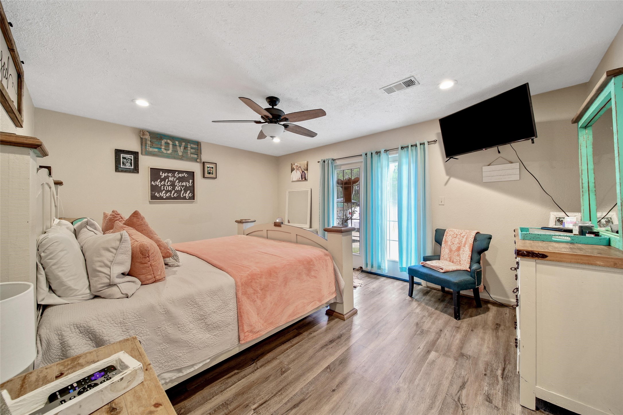 757 Big Woods Road New Waverly, TX 77358 - Photo 22 of 50 The primary suite provides a private set of French doors that you outside to your very own hot tub!