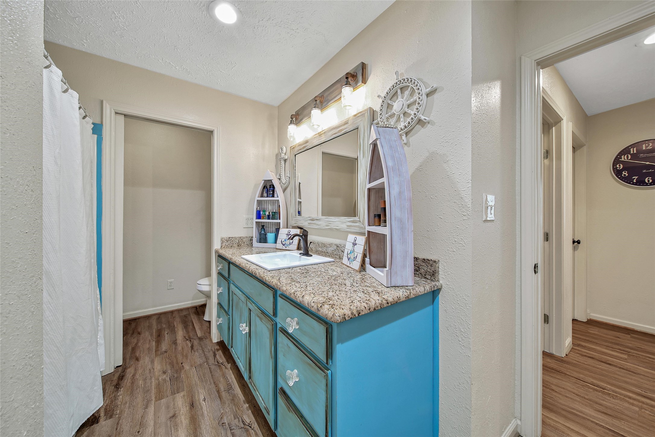 757 Big Woods Road New Waverly, TX 77358 - Photo 29 of 50 a bathroom with a granite countertop sink a mirror and a shower