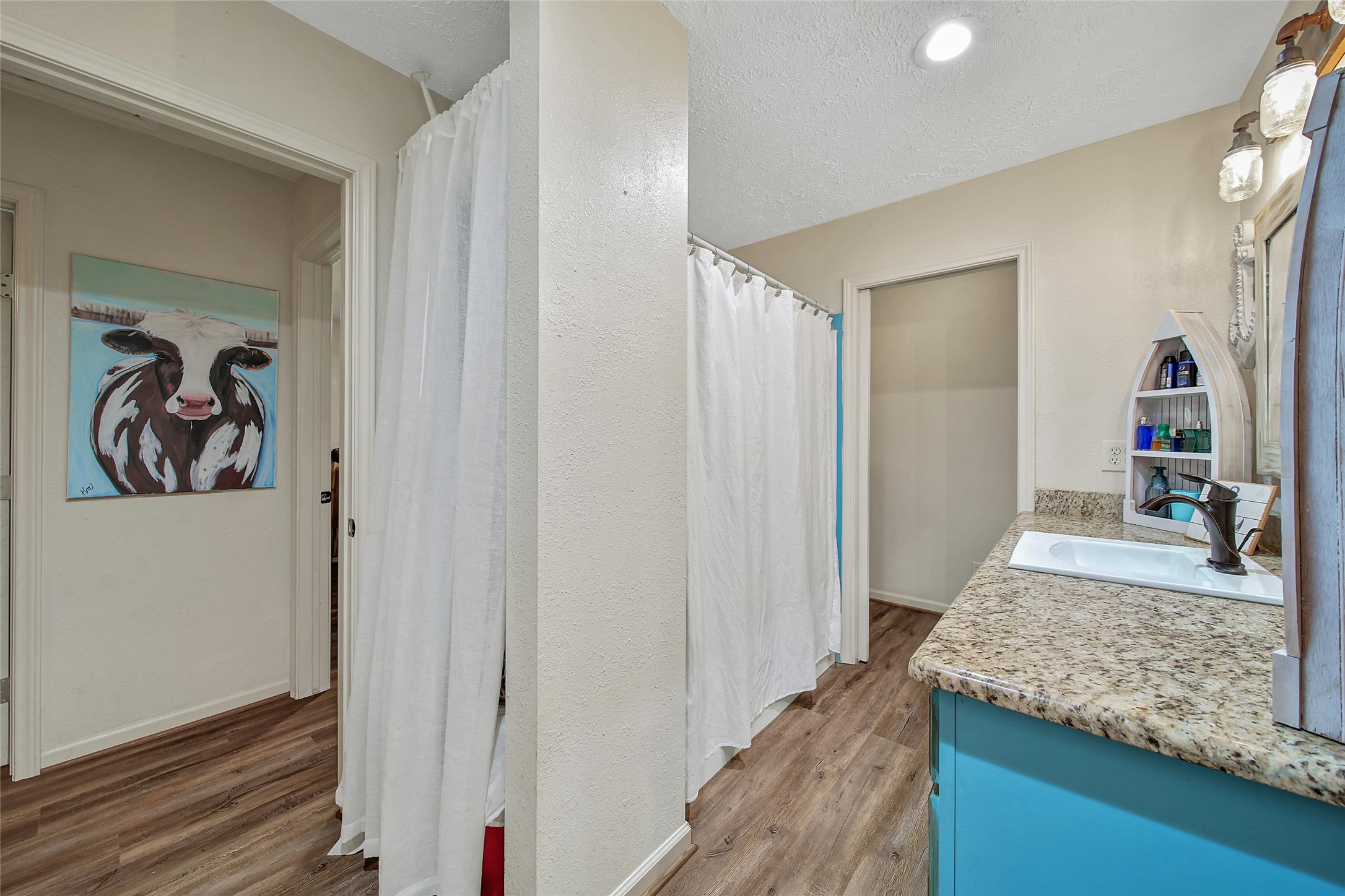 757 Big Woods Road New Waverly, TX 77358 - Photo 30 of 50 a view of a living room and bathroom