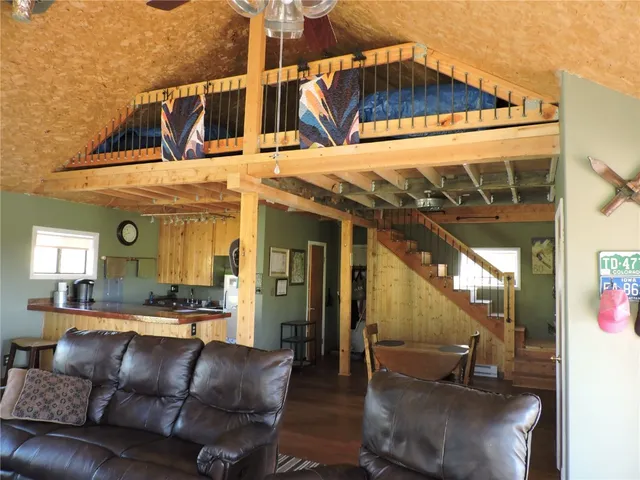 a view of a patio with a table and chairs