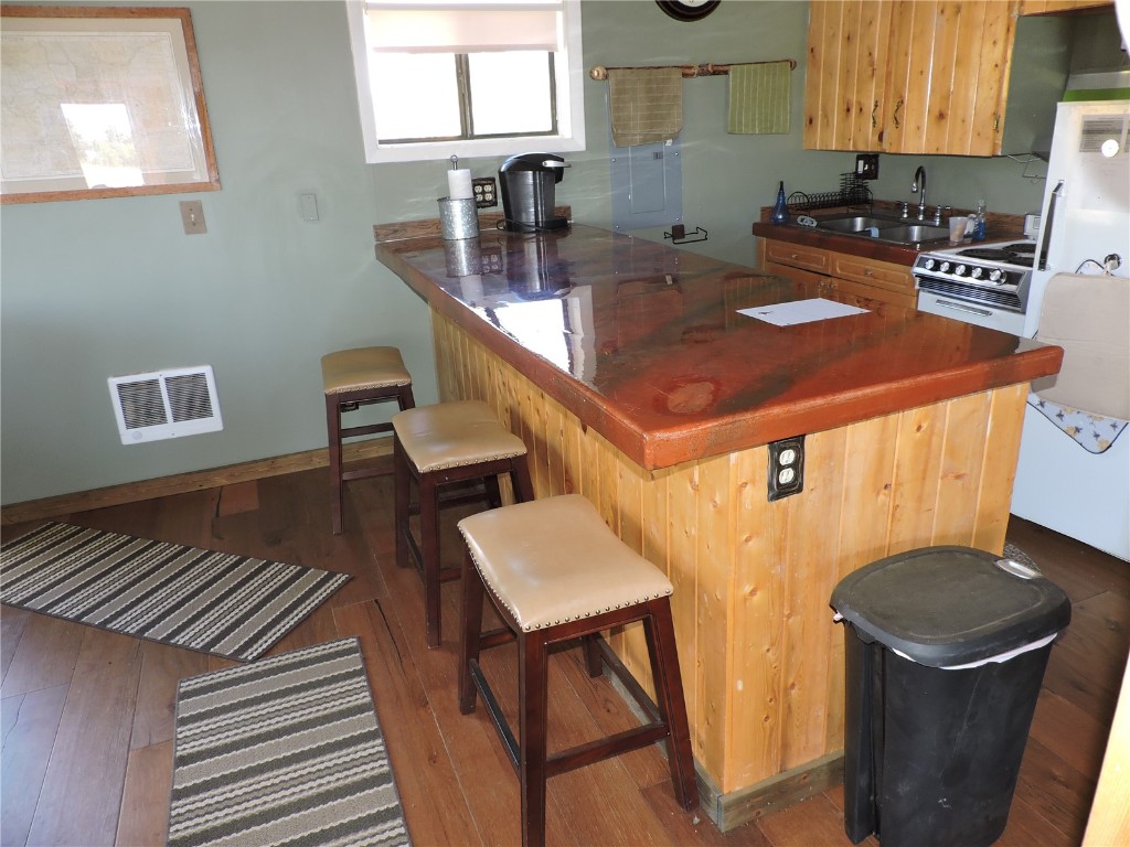 16 Buckshot Trail Como, CO 80432 - Photo 18 of 46 a kitchen with a sink a stove and a refrigerator