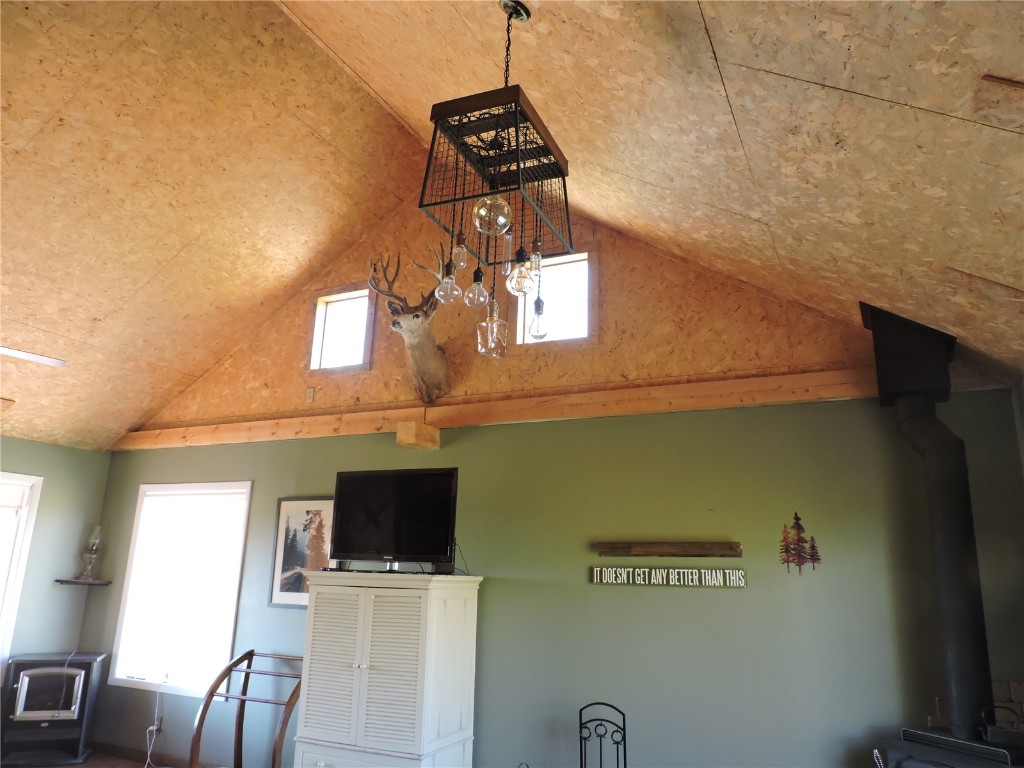 16 Buckshot Trail Como, CO 80432 - Photo 20 of 46 a view of a livingroom with furniture fridge and wooden floor
