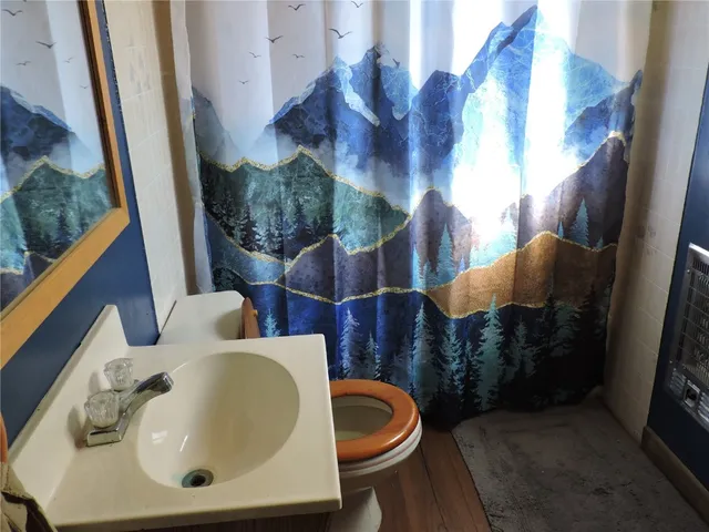 a view of closet with wooden floor