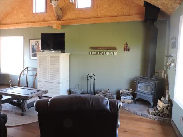 a room with furniture and a flat screen tv