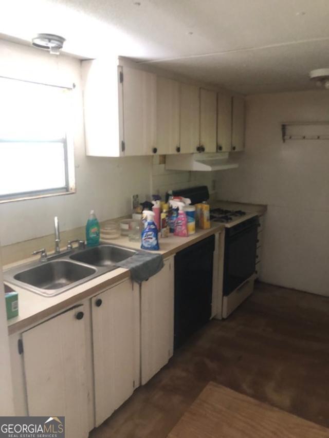 2050 N Highway Temple, GA 30179 - Photo 3 of 6 a kitchen with a sink and cabinets