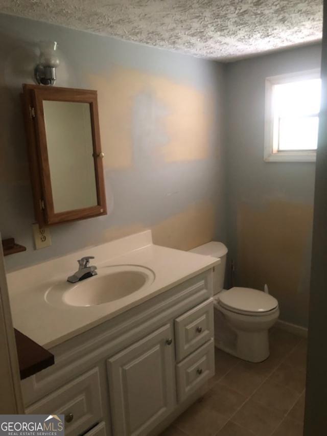 2050 N Highway Temple, GA 30179 - Photo 5 of 6 a bathroom with a toilet sink and mirror