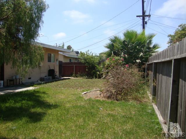 925 Rialto Street Oxnard, CA 93035 - Photo 14 of 20 a backyard of a house with plants and large tree