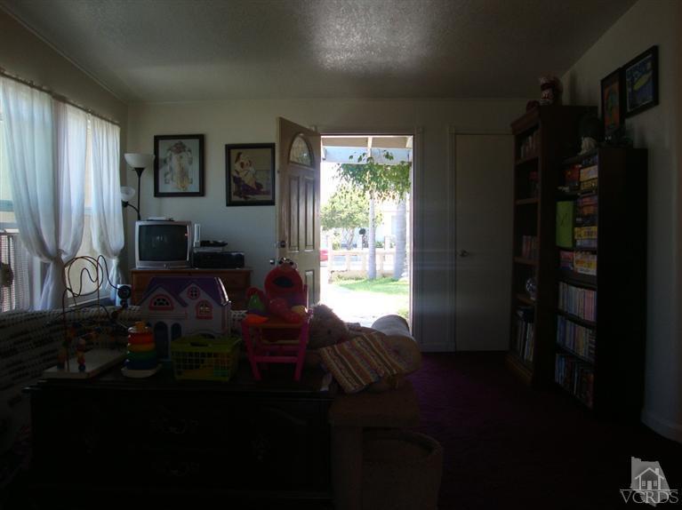 925 Rialto Street Oxnard, CA 93035 - Photo 6 of 20 a living room with furniture wooden floor and a window
