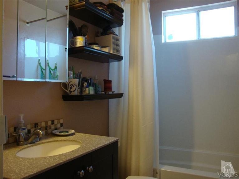 925 Rialto Street Oxnard, CA 93035 - Photo 10 of 20 a bathroom with a sink and a mirror