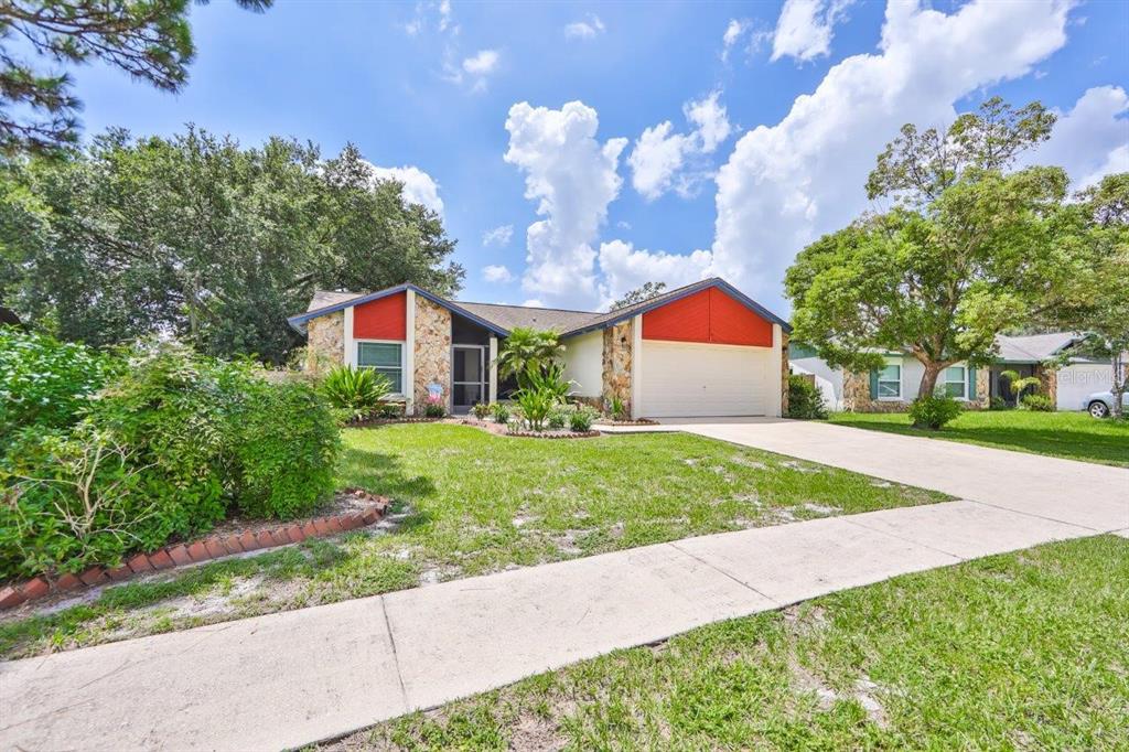 1007 Elm Grove Lane Valrico, FL 33596 - Photo 1 of 1 a front view of a house with garden