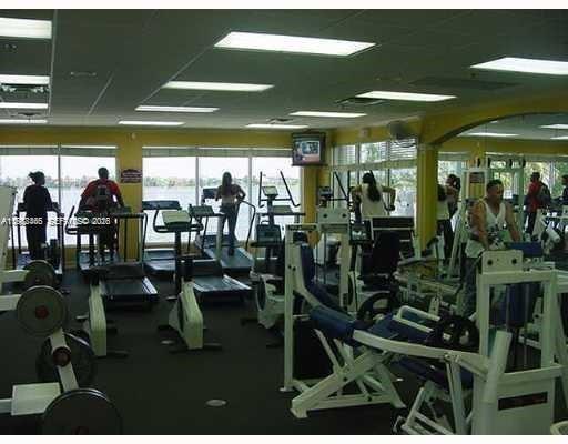 18741 Southwest 25th Court Miramar, FL 33029 - Photo 12 of 32 a room with lots of gym equipment