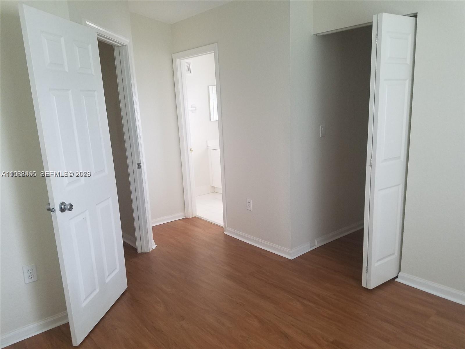 18741 Southwest 25th Court Miramar, FL 33029 - Photo 18 of 32 an empty room with wooden floor and entrance