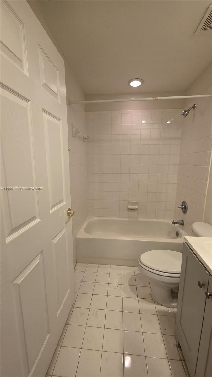 18741 Southwest 25th Court Miramar, FL 33029 - Photo 23 of 32 a bathroom with a sink a toilet and shower