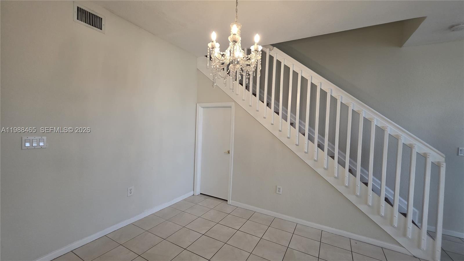 18741 Southwest 25th Court Miramar, FL 33029 - Photo 25 of 32 a view of staircase with railing and a chandelier