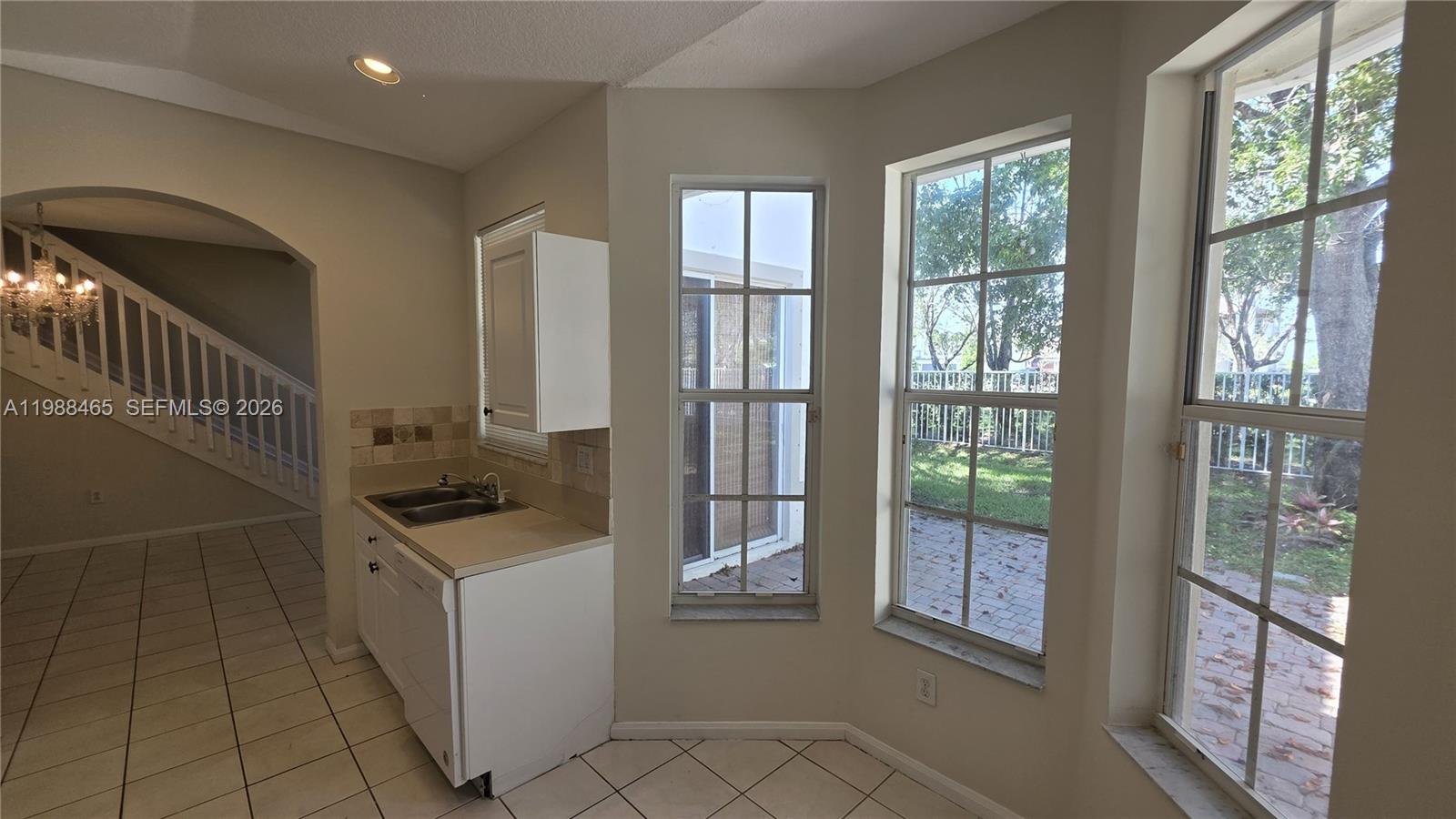 18741 Southwest 25th Court Miramar, FL 33029 - Photo 32 of 32 a kitchen with a sink a counter top space and stainless steel appliances