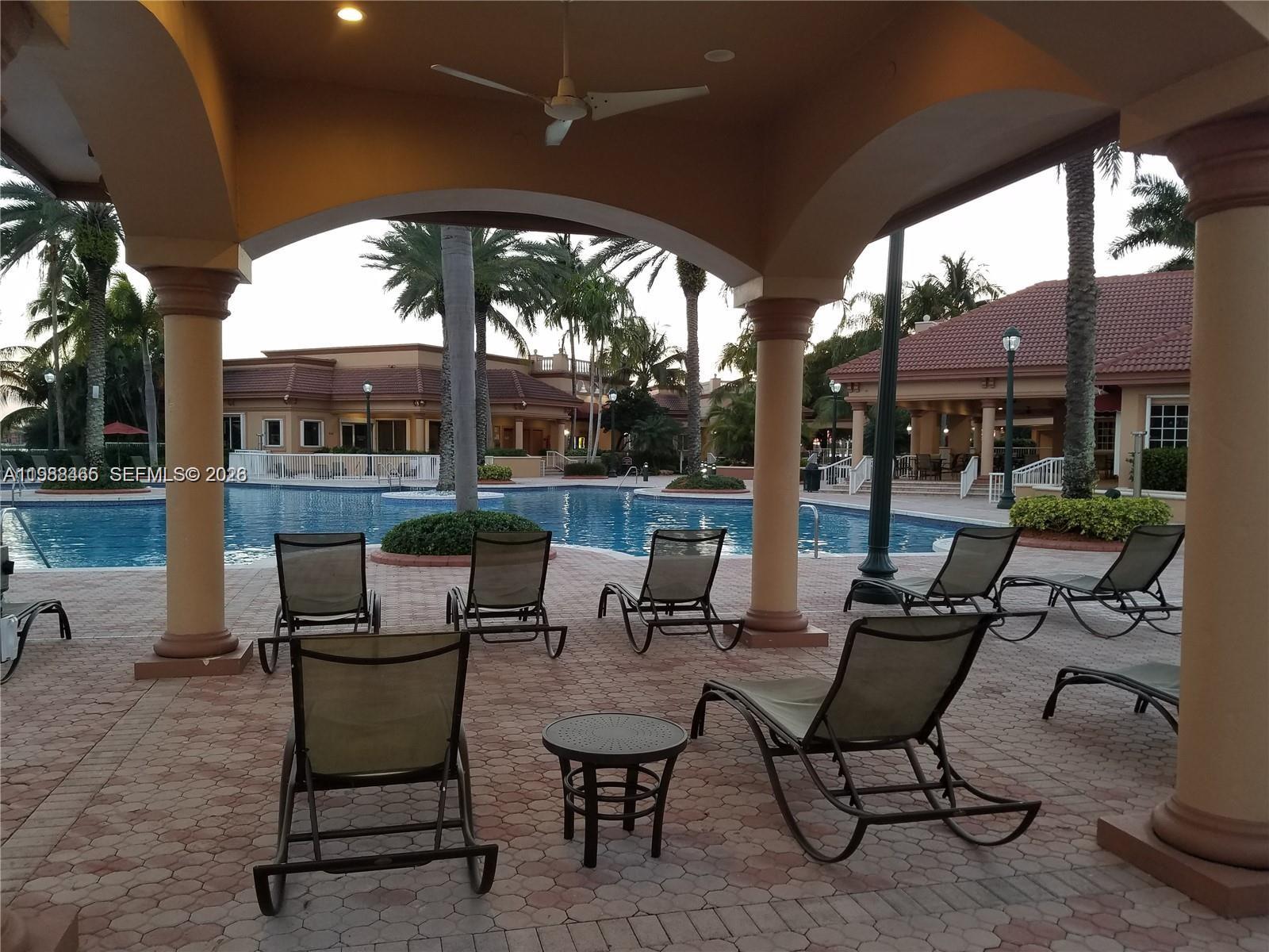 18741 Southwest 25th Court Miramar, FL 33029 - Photo 5 of 32 a view of a patio with chairs and table in patio