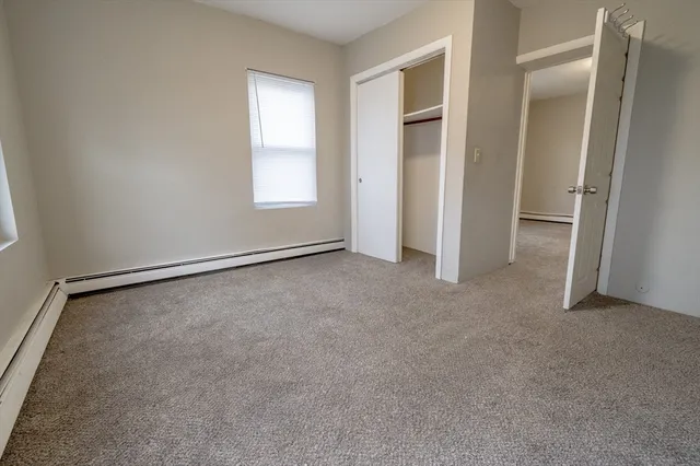 an empty room with a empty space and windows