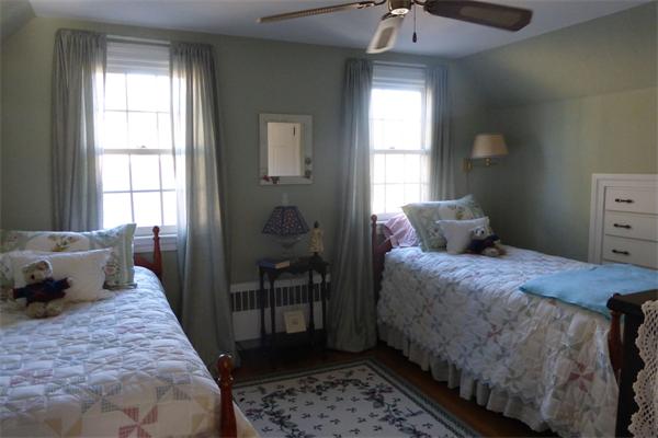305 Sterling Road Lancaster, MA 01523 - Photo 11 of 21 a bedroom with a bed and wooden floor