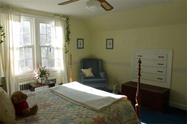 305 Sterling Road Lancaster, MA 01523 - Photo 12 of 21 a bedroom with a bed and wooden floor