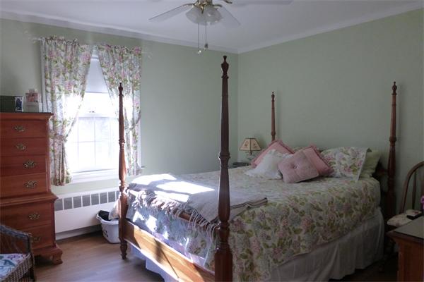 305 Sterling Road Lancaster, MA 01523 - Photo 14 of 21 a bedroom with a bed and a chandelier