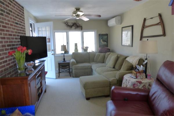 305 Sterling Road Lancaster, MA 01523 - Photo 15 of 21 a living room with furniture a flat screen tv and a window