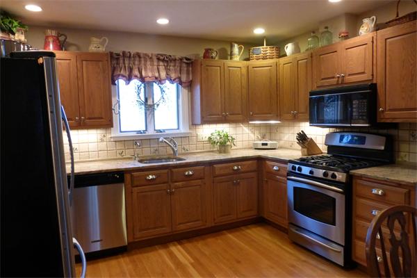 305 Sterling Road Lancaster, MA 01523 - Photo 3 of 21 a kitchen with stainless steel appliances granite countertop a stove a sink and a refrigerator