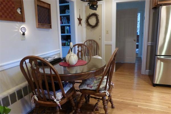 305 Sterling Road Lancaster, MA 01523 - Photo 6 of 21 a view of a dining room with furniture and chandelier
