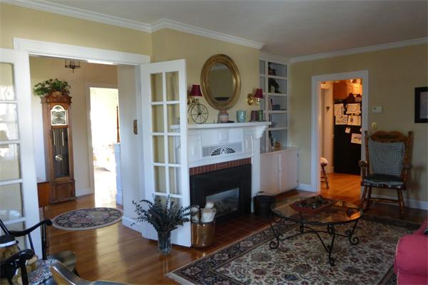 305 Sterling Road Lancaster, MA 01523 - Photo 8 of 21 a living room with furniture a rug and a fireplace