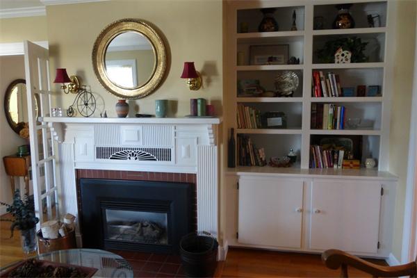 305 Sterling Road Lancaster, MA 01523 - Photo 9 of 21 a living room with hard wood floors and a fireplace