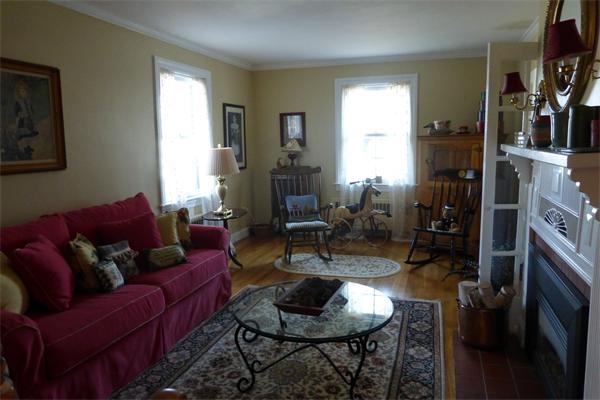 305 Sterling Road Lancaster, MA 01523 - Photo 10 of 21 a living room with furniture and a fireplace