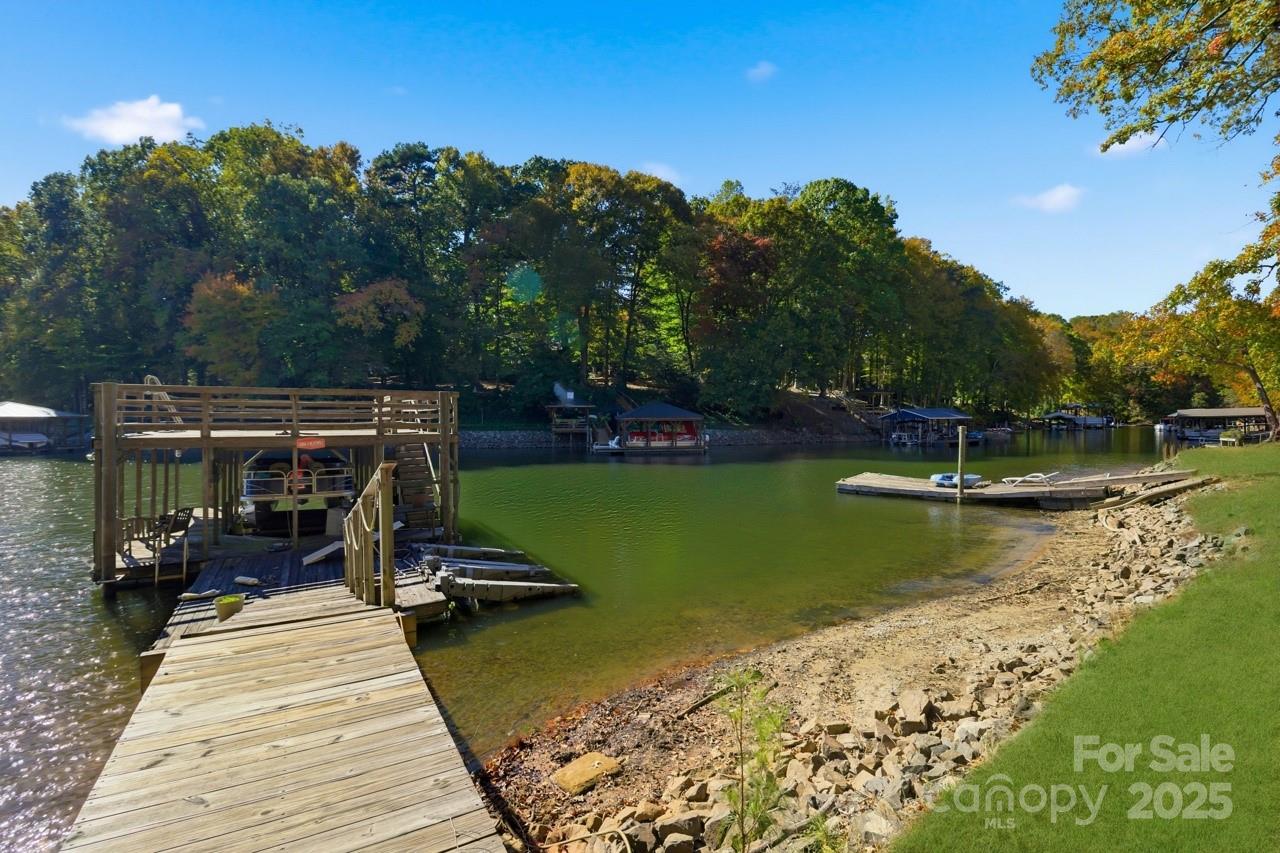 8825 Holdsclaw Road Terrell, NC 28682 - Photo 13 of 33 a view of a lake with a bench in the background