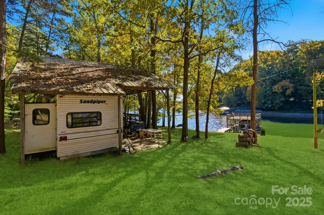 8825 Holdsclaw Road Terrell, NC 28682 - Photo 23 of 33 a view of backyard with sitting area