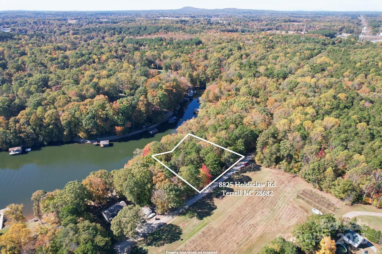 8825 Holdsclaw Road Terrell, NC 28682 - Photo 25 of 33 an aerial view of a house with a yard and lake view