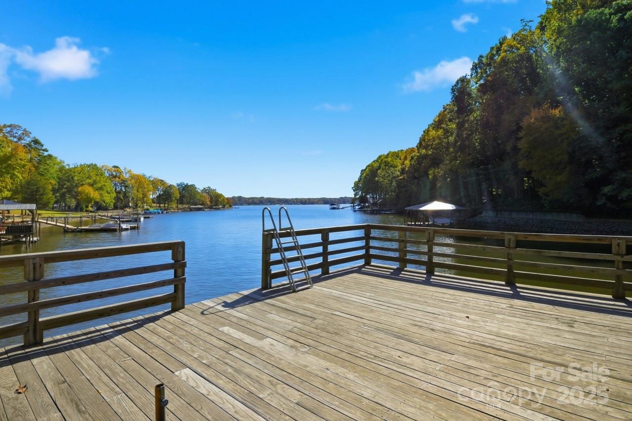 8825 Holdsclaw Road Terrell, NC 28682 - Photo 4 of 33 a view of a roof deck with wooden floor and city view