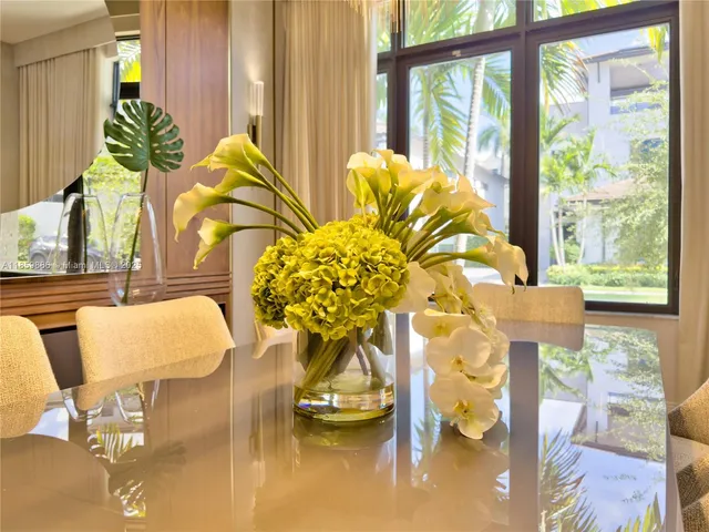 a living room with furniture and large window