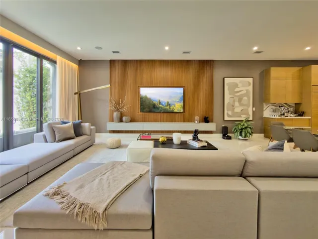 a dining room with furniture a window and appliances