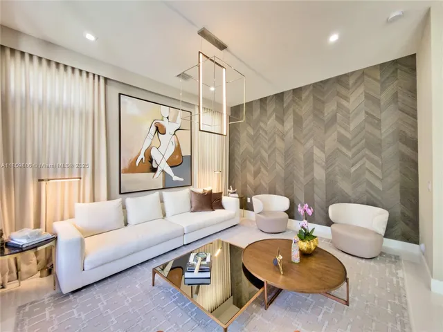 a dining room with furniture and a potted plant