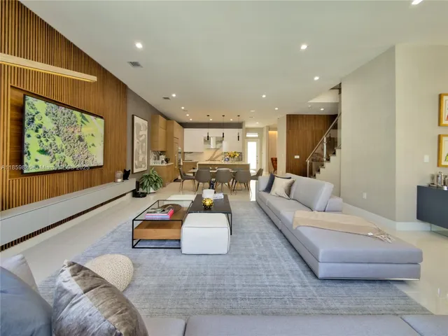 a bathroom with a double vanity sink mirror and shower