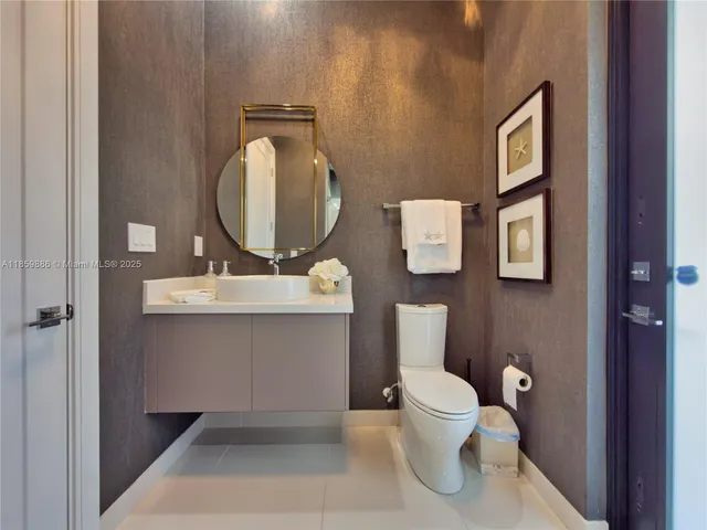 a view of a patio with table and chairs potted plants and large tree