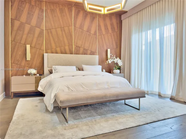 a aerial view of a house with a yard and potted plants