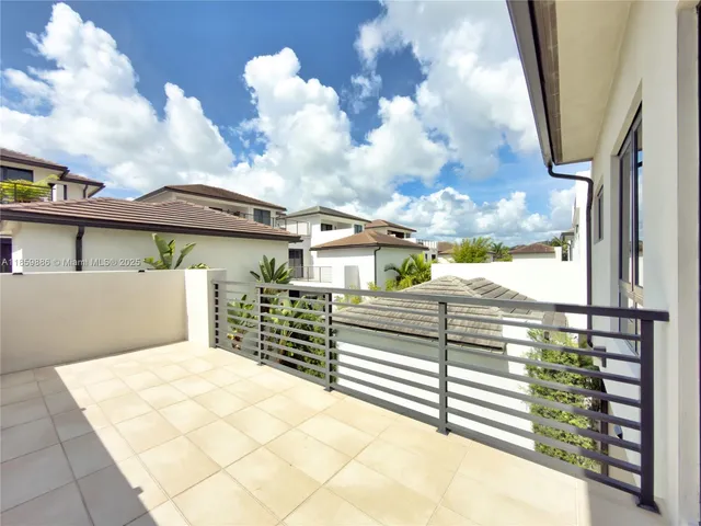 a living room with furniture and a large mirror