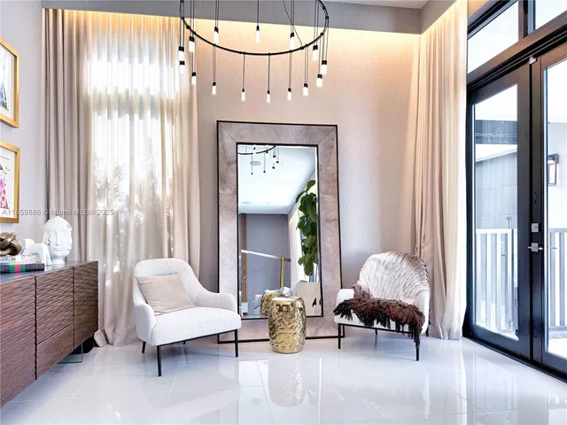 a view of a dining room with furniture and window